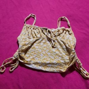 Yellow crop top with white flowers
